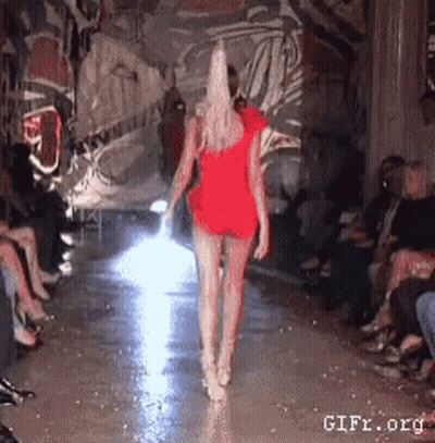 Woman In Red Dress Walking Runway GIF