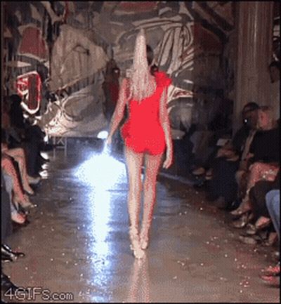 Woman In Red Dress Walking Runway GIF