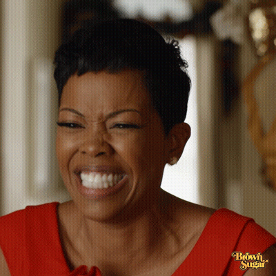Woman In Red Dress With Brown Sugar Sleeve GIF