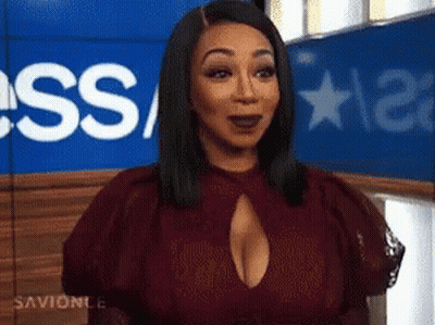 Woman In Red Dress With Plunging Neckline GIF