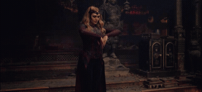Woman In Red Dress With Red Light Hands GIF