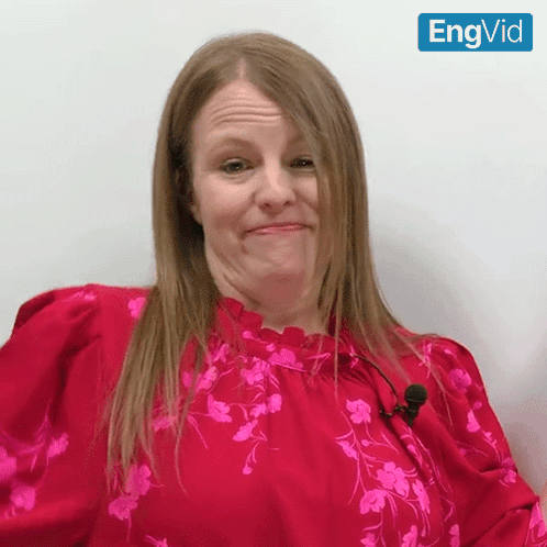 Woman In Red Floral Top Making Funny Face With Engvid GIF