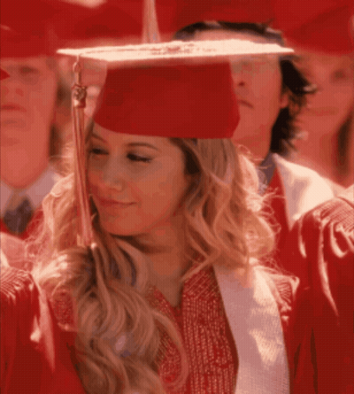 Woman In Red Graduation Cap And Gown Smiling GIF