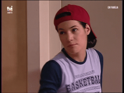 Woman in Red Hat and Basketball Shirt on TVI
