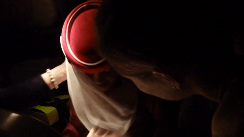 Woman In Red Hat And White Scarf GIF
