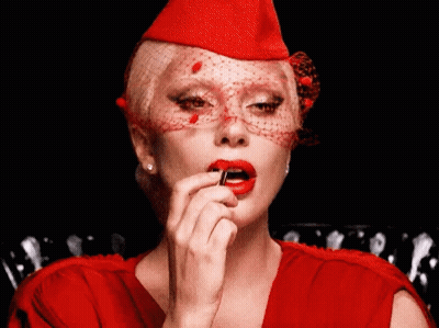 Woman In Red Hat Applying Lipstick GIF