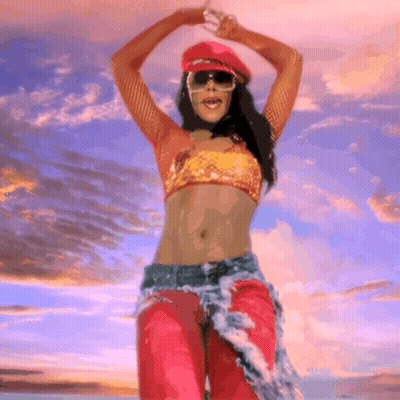 Woman In Red Hat Dancing On Beach GIF