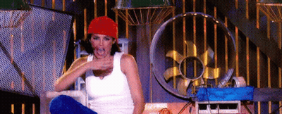Woman In Red Hat Sitting In Room With Fan GIF
