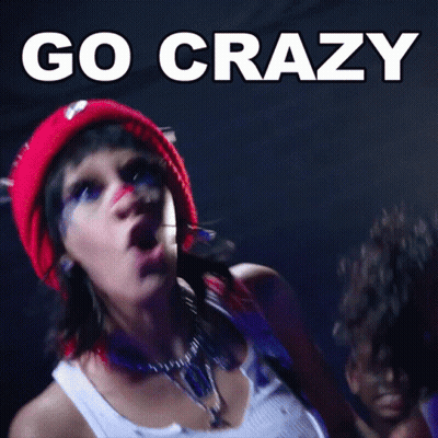 Woman In Red Hat Smiling Crowd Go Crazy GIF