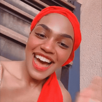 Woman In Red Head Scarf Smiling GIF