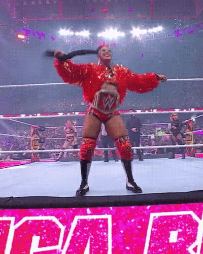 Woman In Red Holding Whip Wrestling Ring Raw GIF