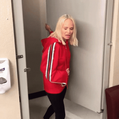 Woman In Red Hoodie At Kleenex Hand Sanitizer GIF