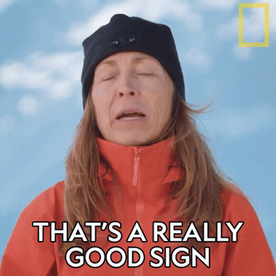 Woman In Red Jacket And Black Hat Says That's A Really Good Sign GIF