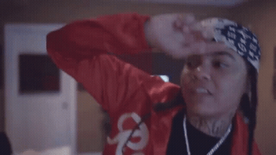 Woman In Red Jacket And Headband Dancing GIF