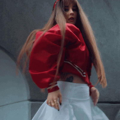 Woman In Red Jacket And White Skirt GIF