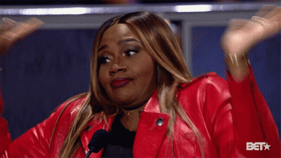 Woman In Red Jacket At Microphone With BET GIF