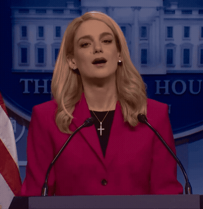 Woman In Red Jacket At Podium Saying Thank GIF