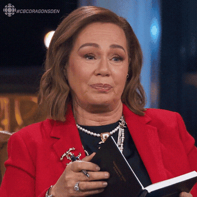 Woman In Red Jacket Holding Book And Pen GIF