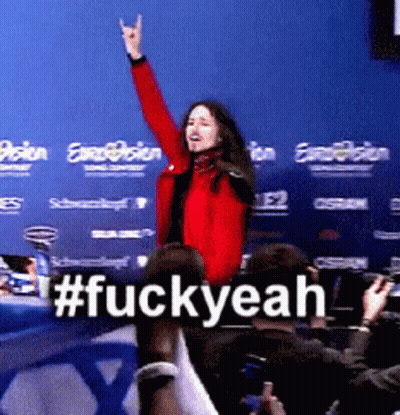 Woman In Red Jacket In Front Of Blue Wall #FuckYeah GIF