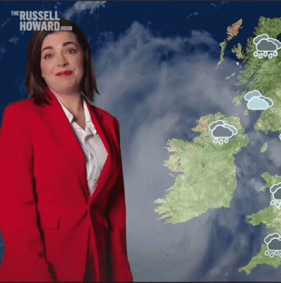 Woman In Red Jacket In Front Of Ireland Map GIF
