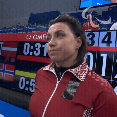 Woman In Red Jacket In Front Of Scoreboard Saying 0:31 GIF
