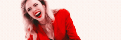 Woman In Red Jacket Laughing Looking Down GIF