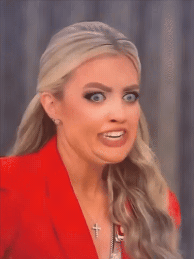 Woman In Red Jacket Making Funny Face GIF