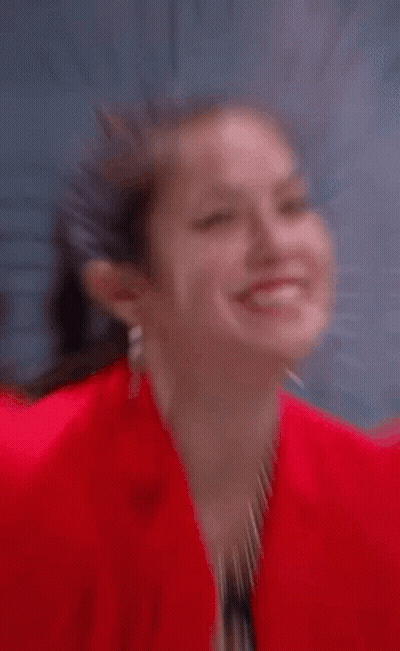 Woman In Red Jacket Making Heart GIF