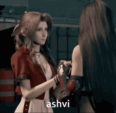 Woman In Red Jacket Saying Ashvi To Another GIF