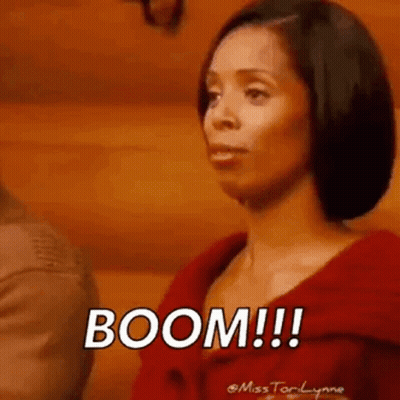 Woman In Red Jacket Saying Boom GIF