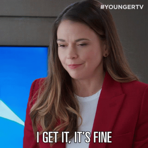 Woman In Red Jacket Saying It's Fine GIF