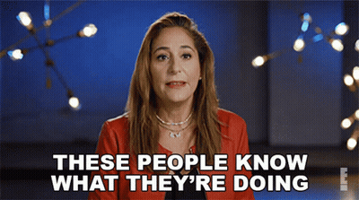 Woman in Red Jacket Saying These People Know What They're Doing