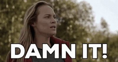Woman In Red Jacket Says Damn It In Front Of Trees GIF