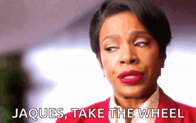 Woman In Red Jacket Says Jacques Take The Wheel GIF