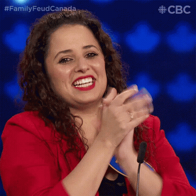 Woman In Red Jacket Smiling And Clapping GIF
