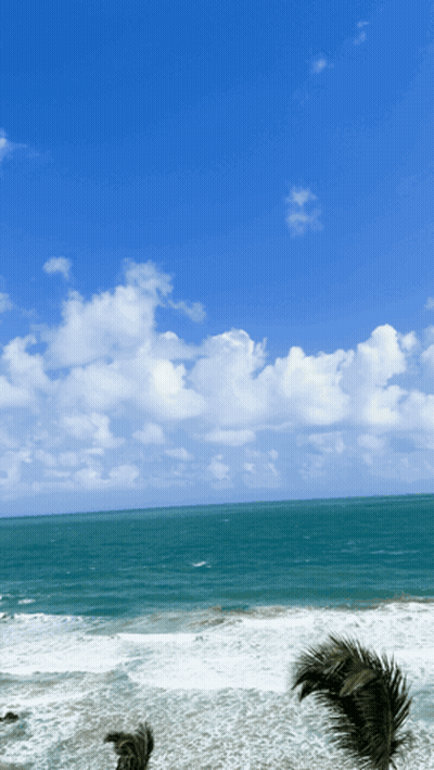 Woman In Red Jacket Standing Before Ireland Map GIF