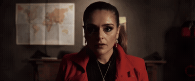 Woman In Red Jacket Standing In Front Of World Map GIF