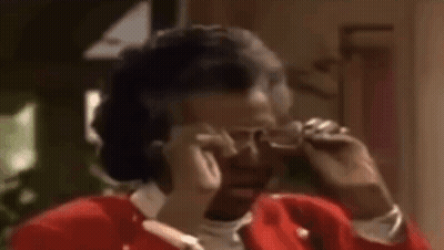 Woman In Red Jacket Talking On Cell Phone GIF