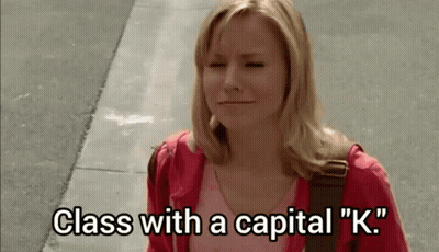Woman In Red Jacket Walking With Eyes Closed GIF