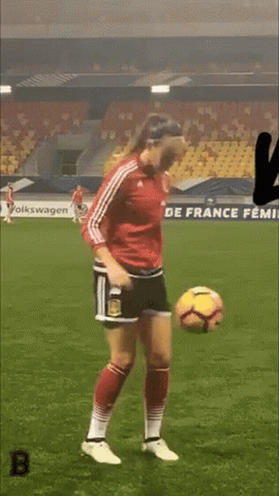Woman In Red Jersey Kicking Soccer Ball GIF