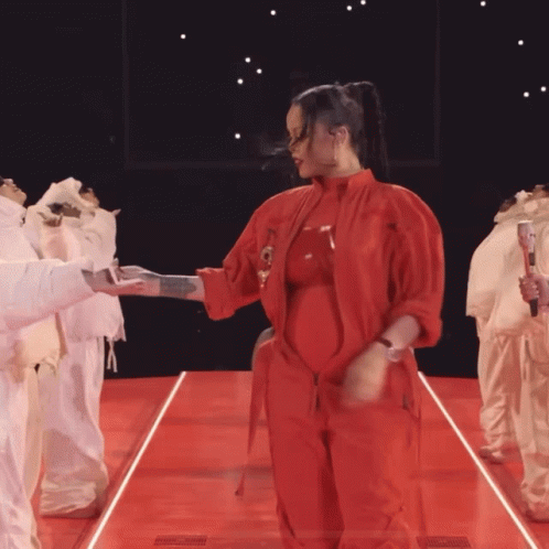 Woman In Red Jumpsuit Dancing GIF