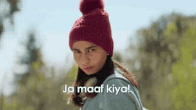 Woman In Red Knitted Hat And Backpack Says Ja Maaf Kiya GIF