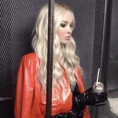Woman In Red Leather Jacket Holding Soda GIF