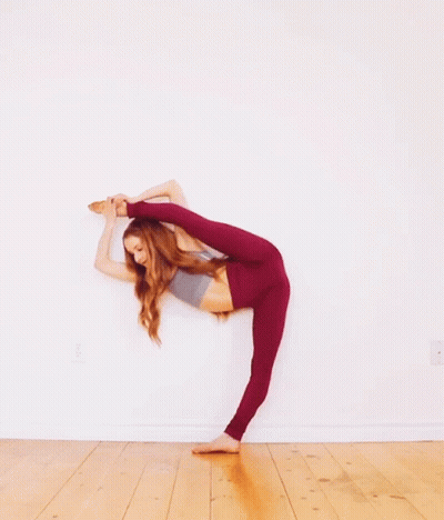 Woman In Red Leggings Doing Split GIF