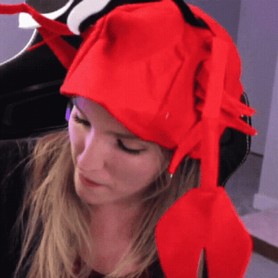 Woman In Red Lobster Hat Looking Down GIF