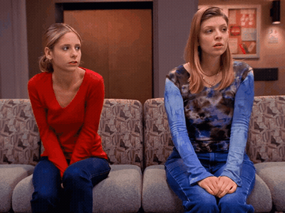 Woman In Red Next To Woman In Blue Tie Dye GIF