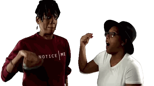 Woman In Red Notice Me Sweater Next To Woman In White Sticker