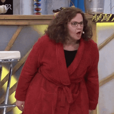 Woman In Red Robe And Glasses In Party Zone GIF