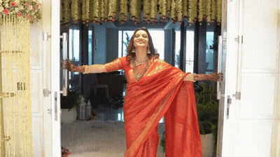 Woman In Red Saree Opens Door GIF