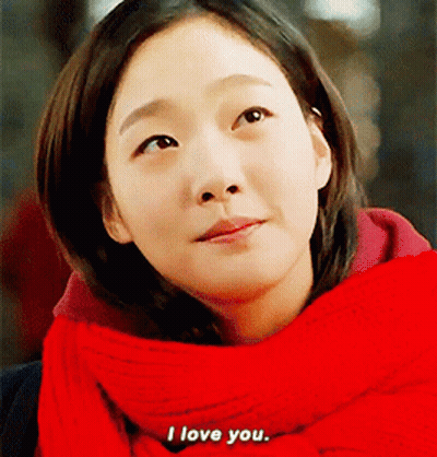 Woman In Red Scarf And Sweater Says I Love You GIF